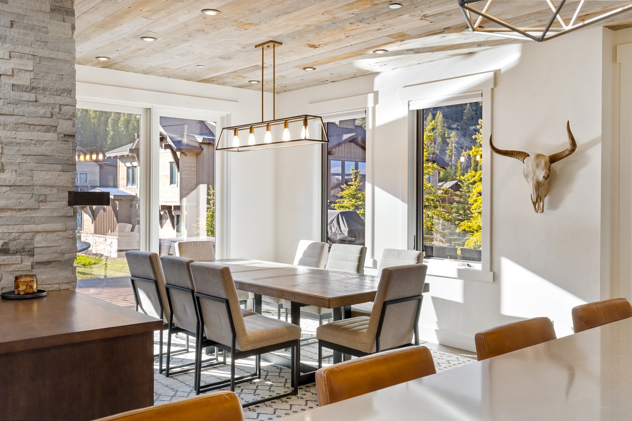 Modern dining area with stylish chairs in a well-appointed home in Big Sky, Montana