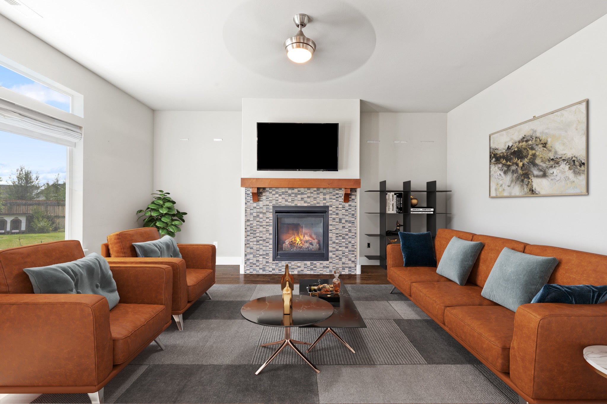 Bright white living room with digitally-rendered orange couch and chairs and black tables in Bozeman, Montana